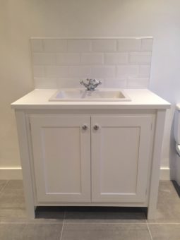 White vanity unit with painted top